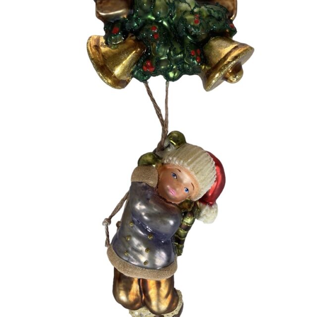 boy under bells