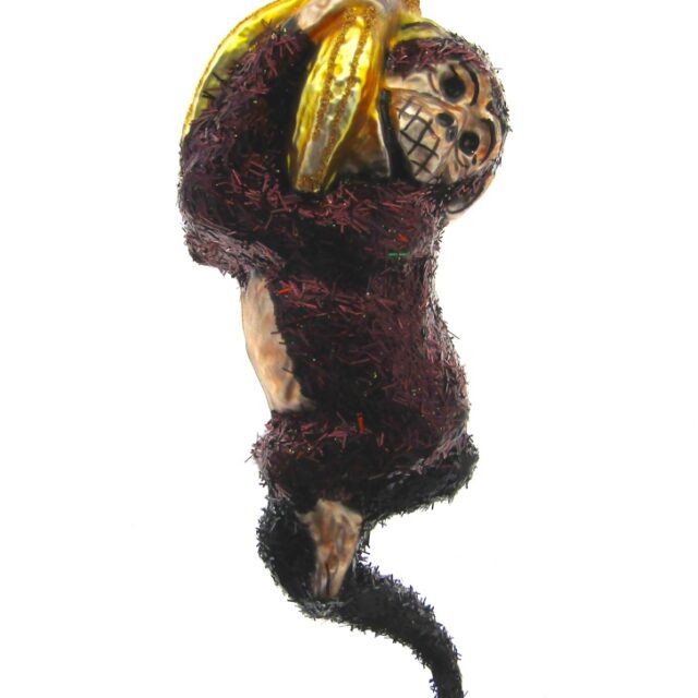 bruine aap aan tros bananen, heerlijke vorm voor in je kerstboom