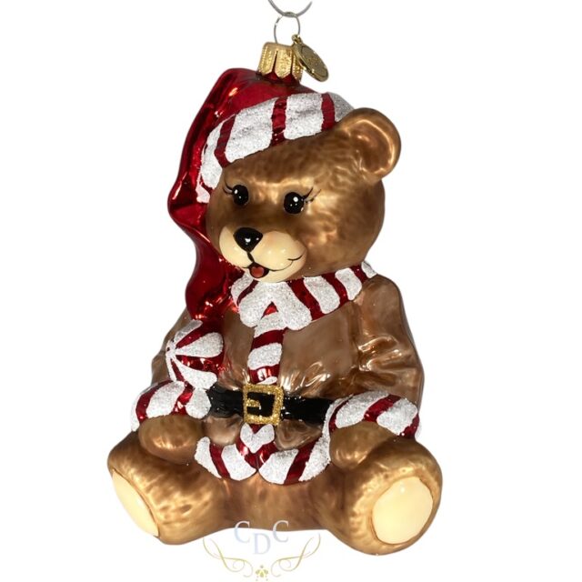 Teddybear with christmas vibes, he choose a coat with red/white trim to get you all in the season's atmosphere