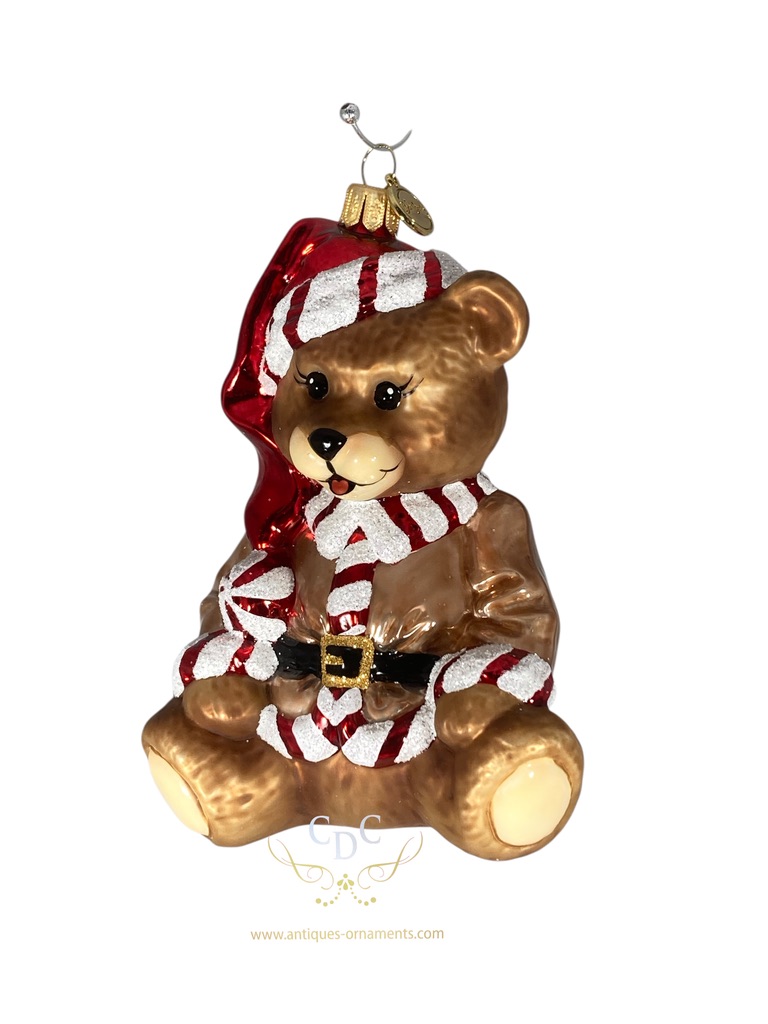 Teddybear with christmas vibes, he choose a coat with red/white trim to get you all in the season's atmosphere